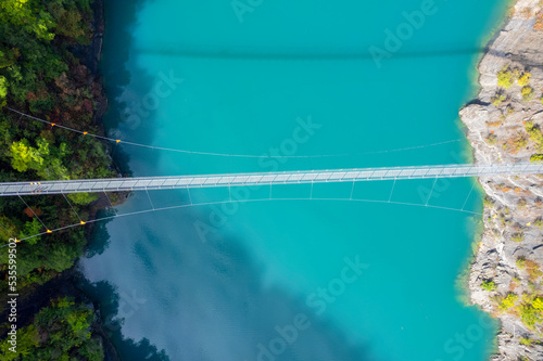 Aerial view of himalayan footbridge crossing the Drac near Lake Monteynard