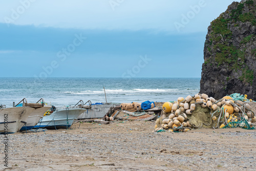 small fishing boats and nets on the seashore