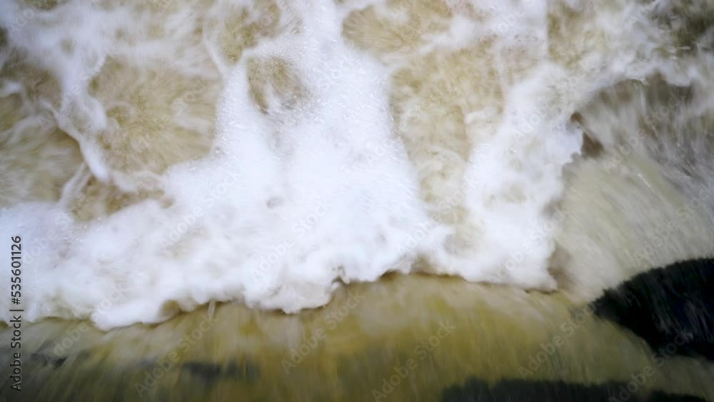 Close up of flowing frothy water Close up of flowing frothy water
