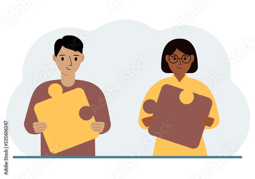 Team metaphor. People putting puzzle pieces together. The concept of teamwork and cooperation. Business concept.