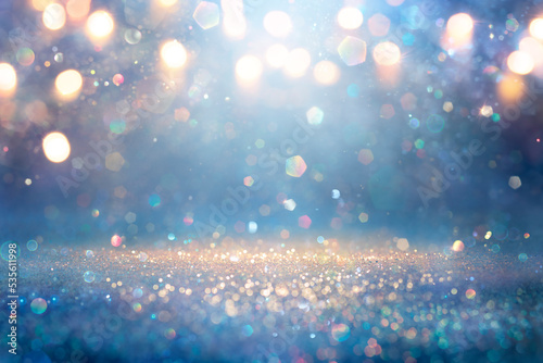 Blue And Golden Glitter In Shiny Defocused Background - Abstract Christmas Lights  photo
