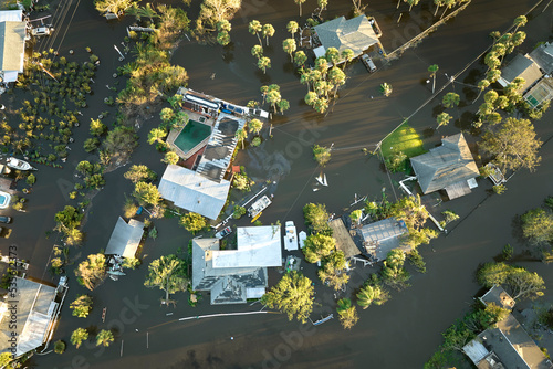 Hurricane Ian flooded houses in Florida residential area. Natural disaster and its consequences