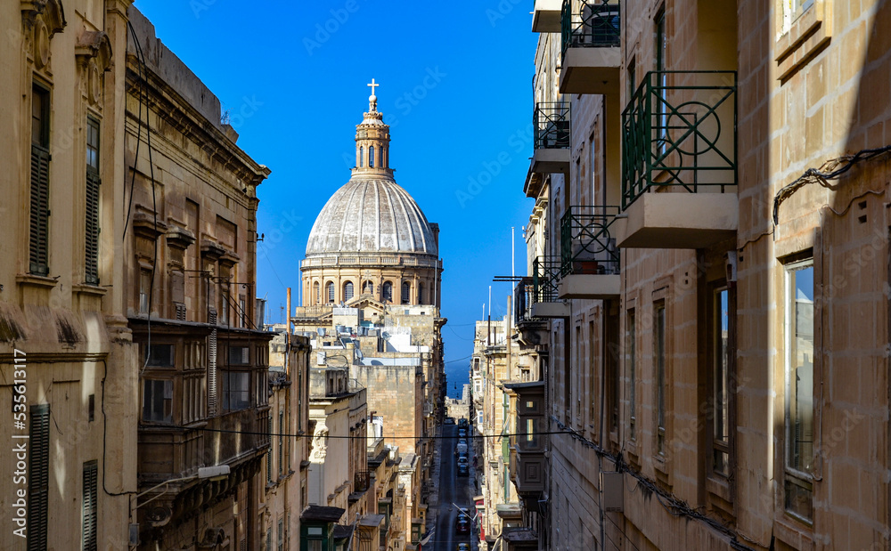View from an alley in Valletta overlooking the dome of the Basilica of Our Lady of Mount Carmel in Malta