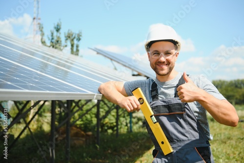 A man working at solar power station.