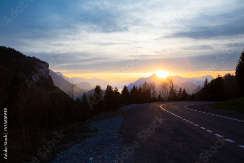 sunset in the alps with an alpine road