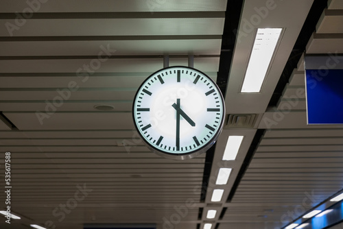 Clock at subway station. Large clock face public transport on a train station platform. Analog clock in public metro subway station or metro train platform. photo