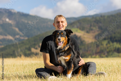 Australian Shepherd and Owner on a Hike