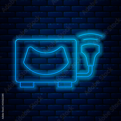 Glowing neon line Ultrasound icon isolated on brick wall background. Medical equipment. Vector