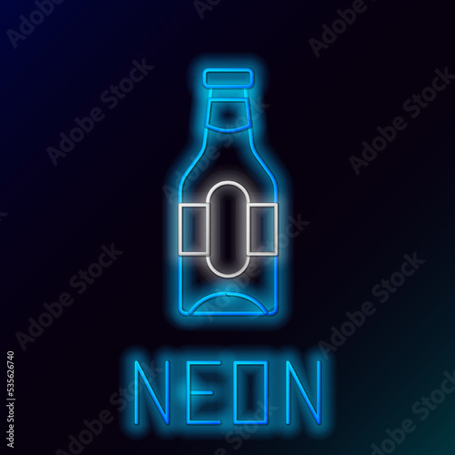 Glowing neon line Beer bottle icon isolated on black background. Colorful outline concept. Vector