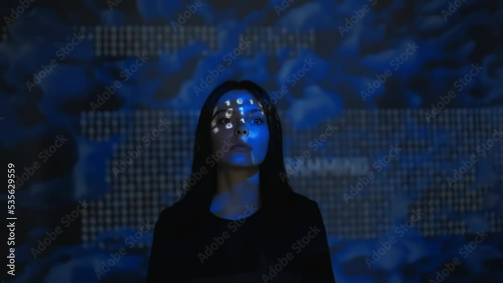 Portrait of woman with glitched projection of zeros and ones on her face and background. Digital world, virtual reality, metaverse and big data concept
