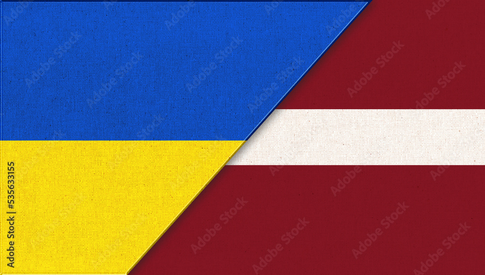 Flag of Ukraine and Latvia. Ukrainian and Latvian flags on fabric surface.