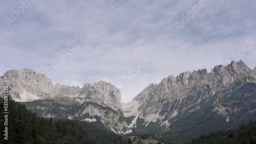 Slow tracking drone shot of a mountain in Austria. The Ellmauer Tor is a famous  part of the Kaisergebirge in the Austrian state of Tyrol. Summer,  Wilde Kaiser, daytime.
 photo