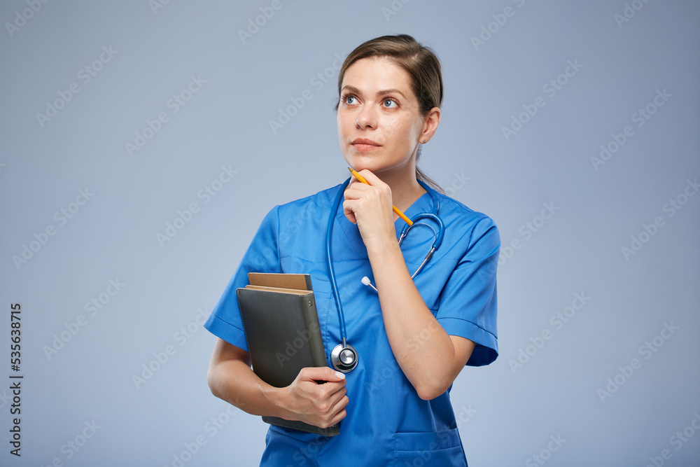 Thinking medical student intern or teacher, doctor woman holding books. Isolated female portrait. Thinking medical student intern or teacher, doctor woman holding books. Isolated female portrait.