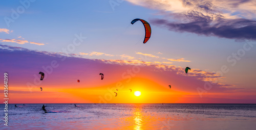 Canvas Print Kite-surfing against a beautiful sunset