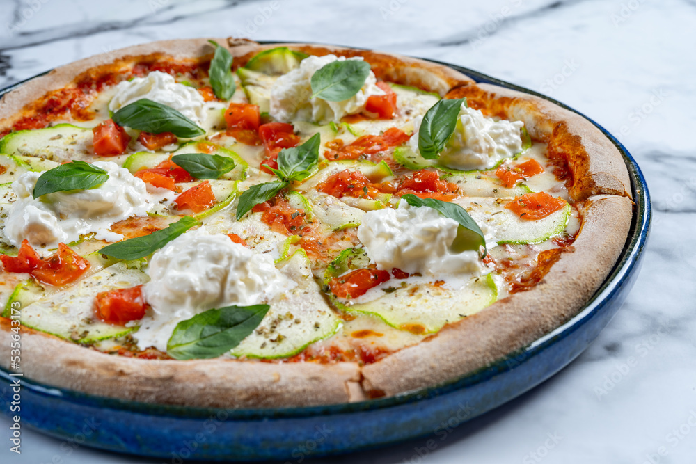 pizza with stracciatella on a white background