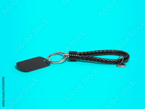 key chain, metal and leather material key chain on a blue background