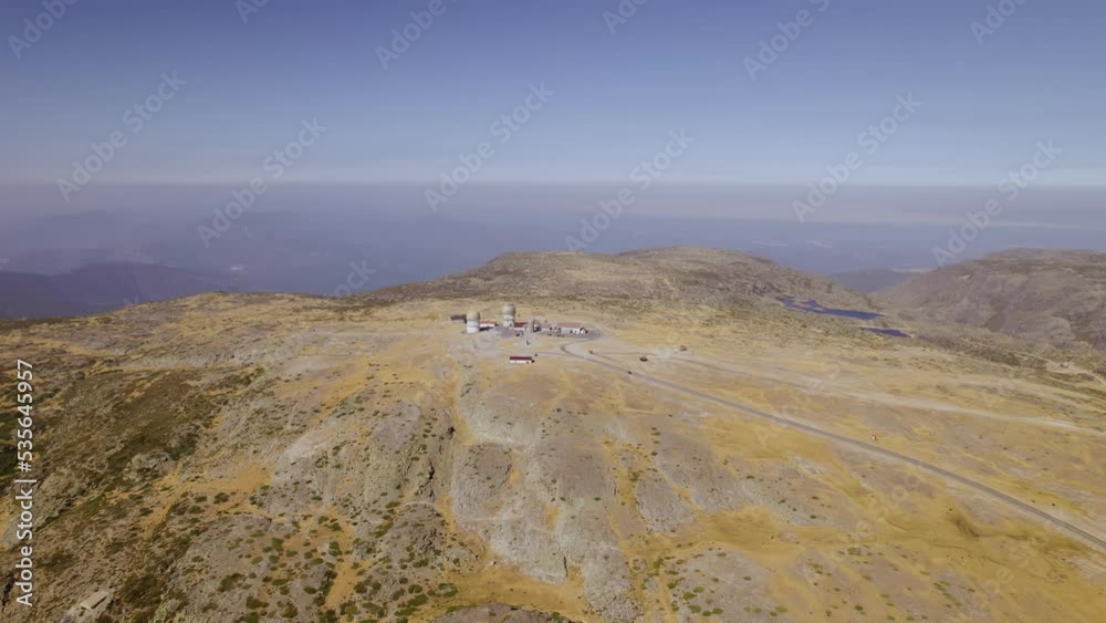 Aerial shot of Torre observatory on Serra da Estrela, in Portugal. Flying upwards and backwards from the radar station. Cinematic 4K Aerial shot of Torre observatory on Serra da Estrela, in Portugal. Flying upwards and backwards from the radar station. Cinematic 4K