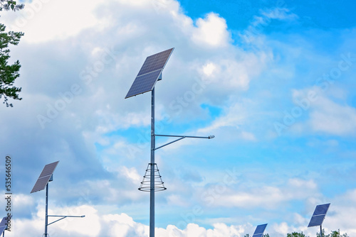 Solar panels on lampposts. Renewable energy sources in the countryside.