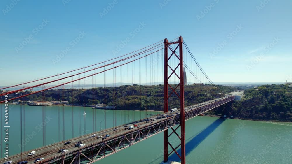 Aerial drone view. Flying around the bridge. Portugal Lisbon. Ponte 25 de abril. Bridge over the ocean Aerial drone view. Flying around the bridge. Portugal Lisbon. Ponte 25 de abril. Bridge over the ocean