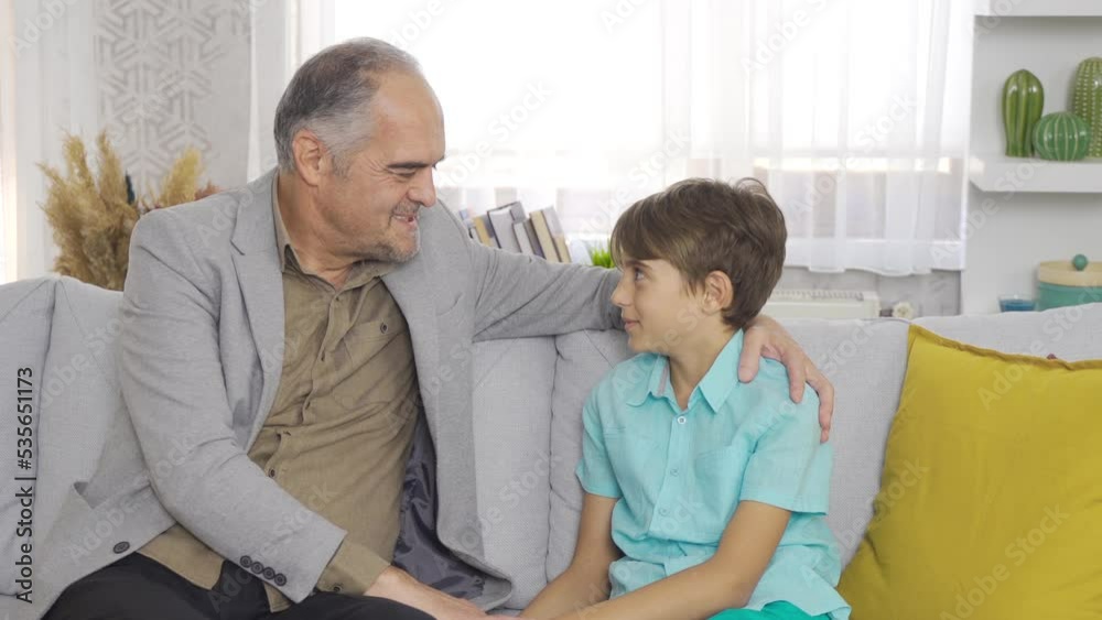 Sad grandfather spends time with his grandson.
The grandfather, who spends time and chat with his grandson at home, is sad.
Sad grandfather spends time with his grandson.
The grandfather, who spends time and chat with his grandson at home, is sad.
