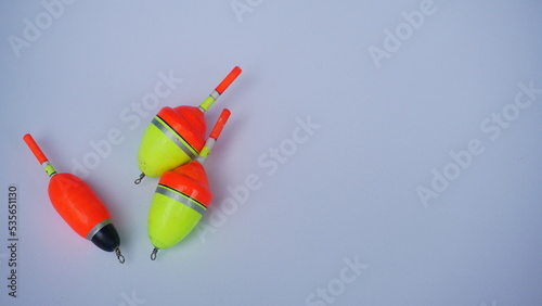 Colorful fishing bobbers isolated on white background. Used so that the fishing bait does not sink to the bottom and as a fishing indicator when the bait is eaten by fish