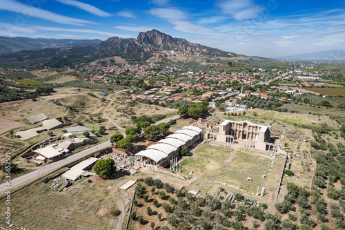Aerial view with drone; Sardes (Sardis) Ancient City which has gymnasium and synagogue ruins and columns in Manisa, Turkey. photo