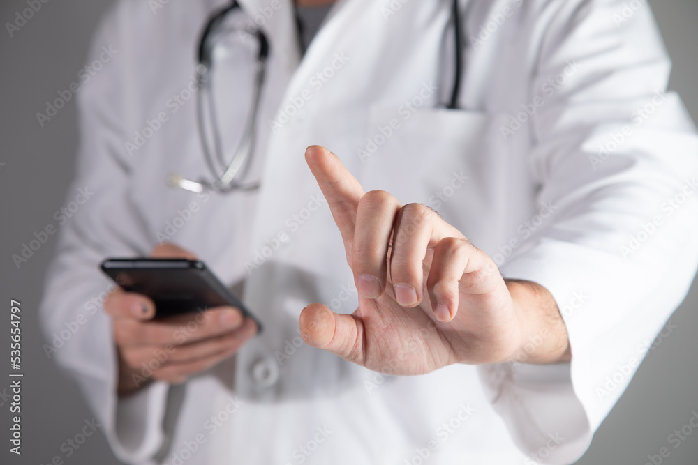 Doctor tapping on a virtual screen Doctor tapping on a virtual screen