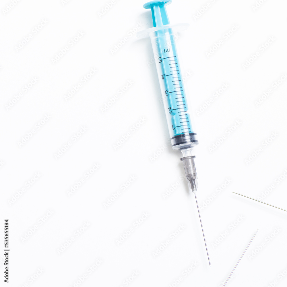 Medical syringe on a white background. A syringe for injection. The concept of health and beauty Medical syringe on a white background. A syringe for injection. The concept of health and beauty
