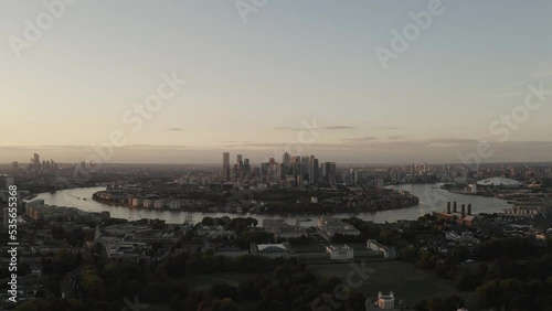 Sunset over Greenwich, London with clouds and river thames. 