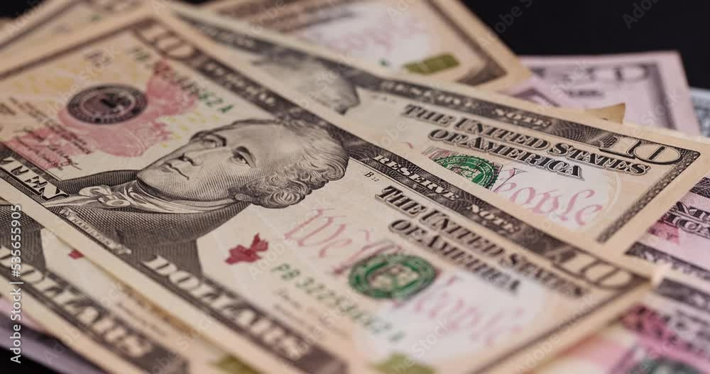 folding American cash dollar bills on black paper, cash paper new American dollars folding American cash dollar bills on black paper, cash paper new American dollars