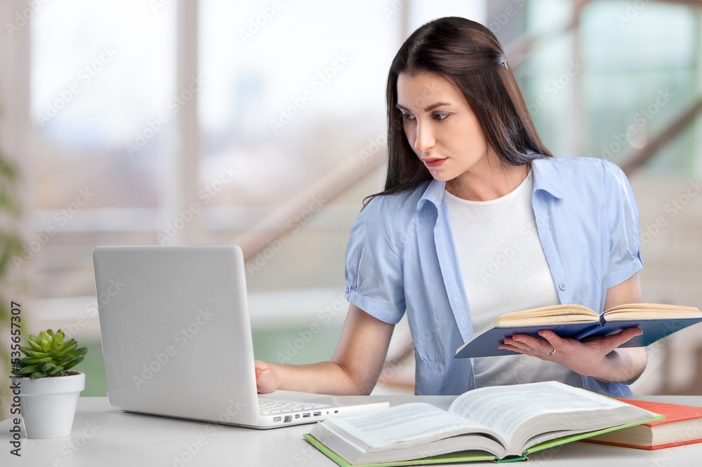 Woman student using computer laptop. Woman student using computer laptop.