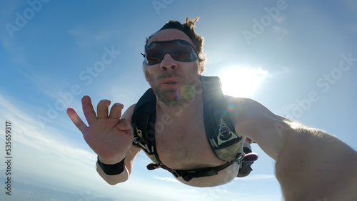 Skydiving selfie over the beach