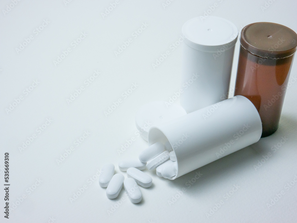 white pill on wood table for sci or medical concept white pill on wood table for sci or medical concept