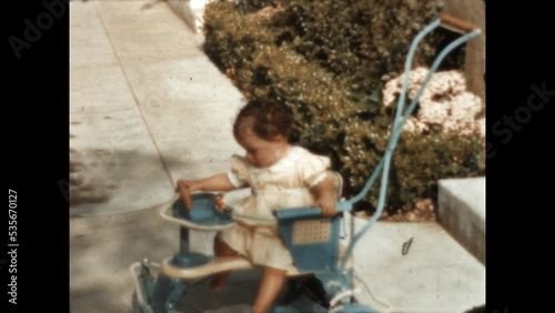 Taylor Tot Stroller 1940 - A young child sits in a Taylor Tot stroller in Los Angeles, California in 1940.  photo
