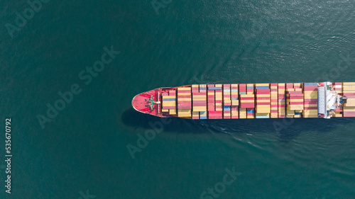 Cargo container Ship, cargo maritime ship with contrail in the ocean ship carrying container and running for export  concept technology freight shipping sea freight by Express Ship