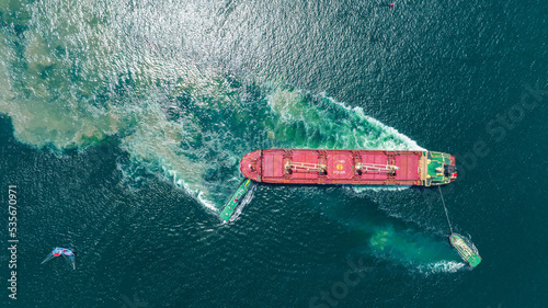 Tug Boat drag Barge ship carry Metal steel pipe construction unit , No International Sewage sludge Pollution Prevention Certificate, Sewage Sludge in the sea made by Activity of ship concept