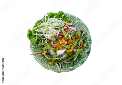Wings Bean Spicy Salad (Yum-Tua-Phuu) on green ceramic isolated on white background with clipping path. Authentic thai food. Top view, Selective focus. photo