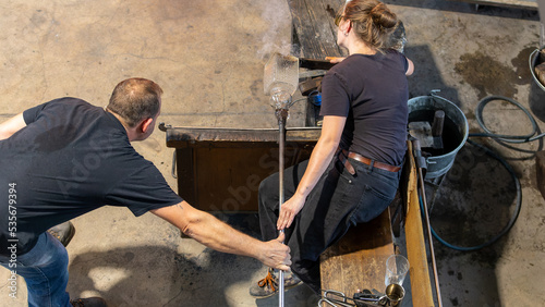 Glassblower at work in the Meisenthal's glassware in September 2022 photo