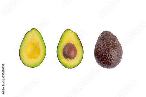 whole and half avocado isolated on transparent background close-up.