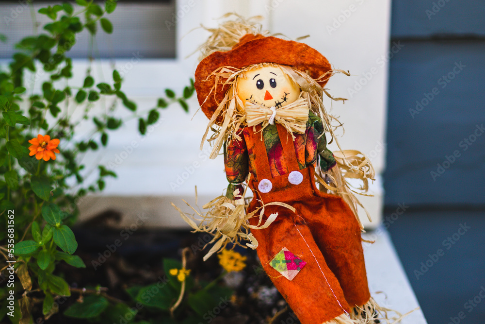 Mini scarecrow in window box