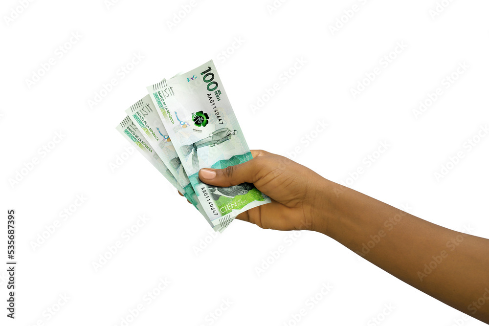 Fair hand holding 3D rendered Colombian peso notes isolated on white background Fair hand holding 3D rendered Colombian peso notes isolated on white background