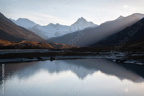 mountains glacier lake reflection sunlight autumn