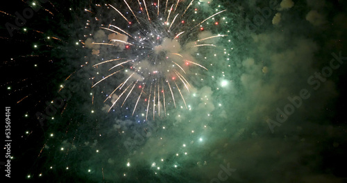 Green Firework celebrate anniversary happy new year 2023  4th of july holiday festival. Green firework in night time celebrate national holiday. Countdown to new year 2023 festival party time event