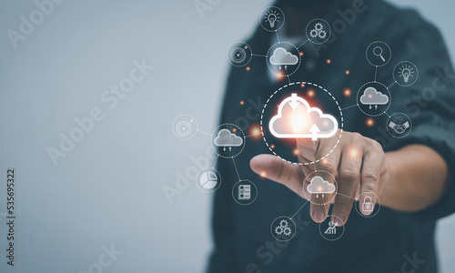 Businessman touching cloud icon , concept of big data management ,global network connection ,searching for information Using computer resources to transact with Internet technology online