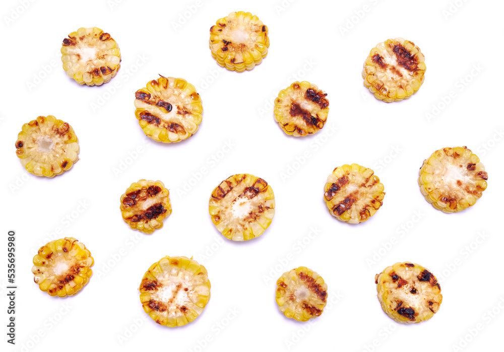 Grilled Slices of corn cobs with stripes from a grill isolated on white background Grilled Slices of corn cobs with stripes from a grill isolated on white background
