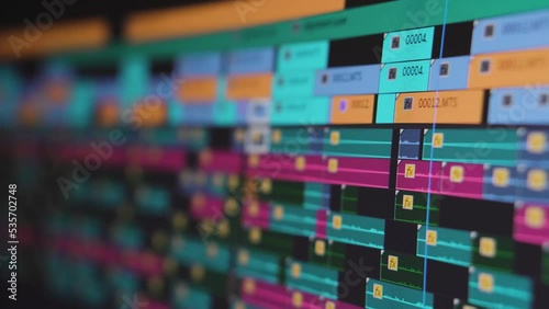 Video editing. Playhead moving through a complex timeline. Screen close up