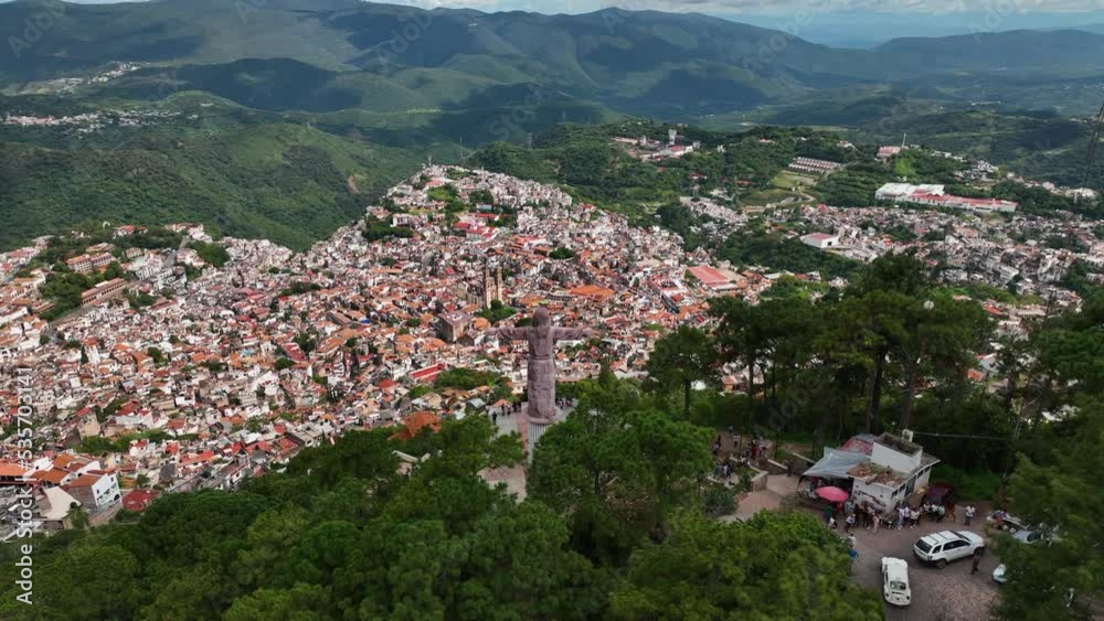 Aerial view around the Cristo Taxqueño statue and the viewpoint of Taxco Guerrero city, in sunny Mexico - orbit, drone shot Aerial view around the Cristo Taxqueño statue and the viewpoint of Taxco Guerrero city, in sunny Mexico - orbit, drone shot