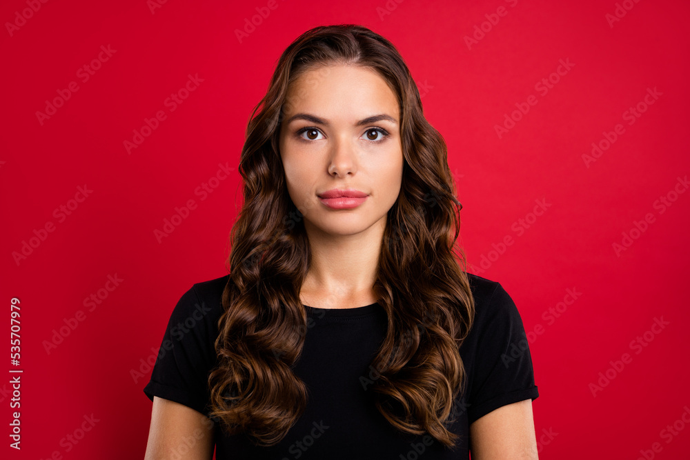 Photo of adorable pretty young woman wear black t-shirt smiling isolated red color background Photo of adorable pretty young woman wear black t-shirt smiling isolated red color background