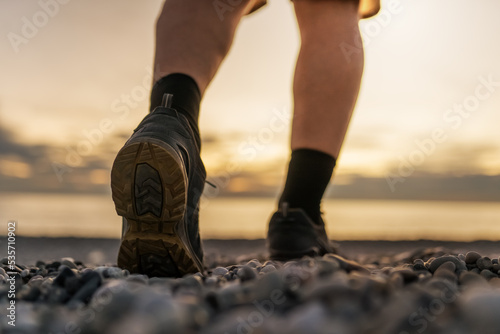 person walking on the beach