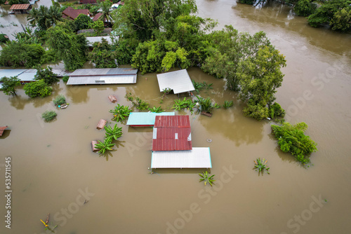 High-angle view of the Great Flood, Meng District, Thailand, on October 3, 2022, is a photograph from real flooding. With a slight color adjustment
